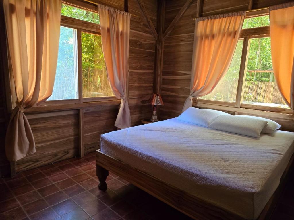 Postel nebo postele na pokoji v ubytování Nueva Tierra