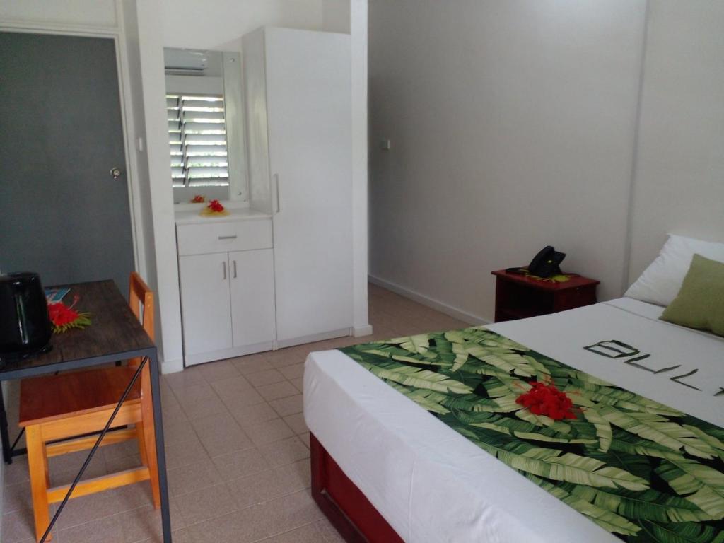 Rúm í herbergi á Yatu Lau Transit Hotel