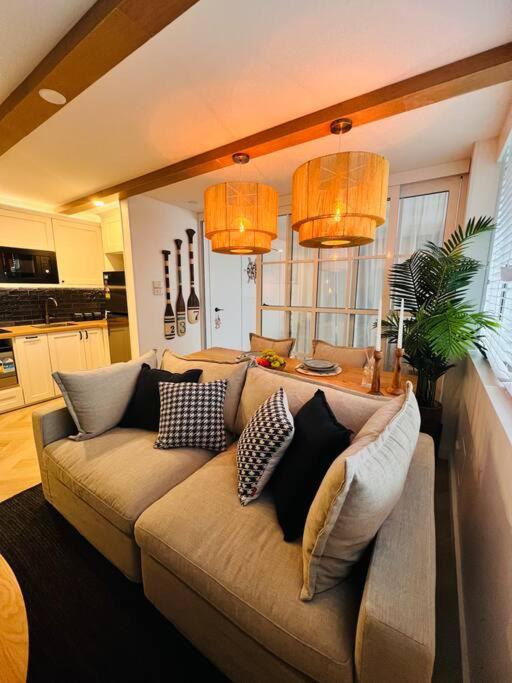 a living room with a couch with pillows on it at Nautical living in Manly in Sydney