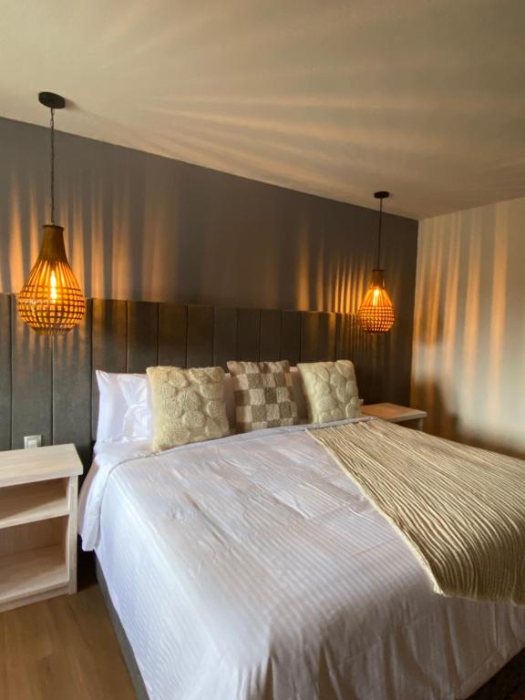 Postel nebo postele na pokoji v ubytování Altamonte Hotel Boutique