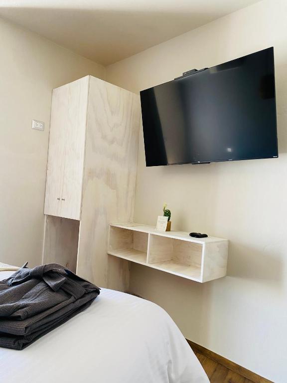 TV a/nebo společenská místnost v ubytování Altamonte Hotel Boutique