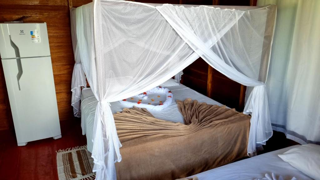 Postel nebo postele na pokoji v ubytování LUZ AMAZÔNIA LODGE
