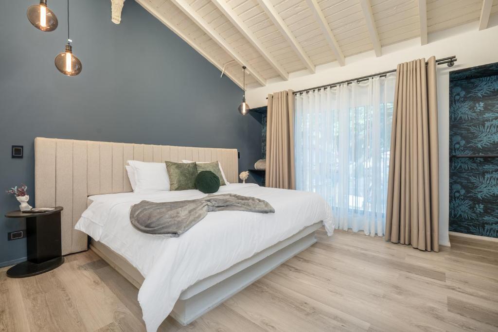 Postel nebo postele na pokoji v ubytování Nago Hometel Boutique