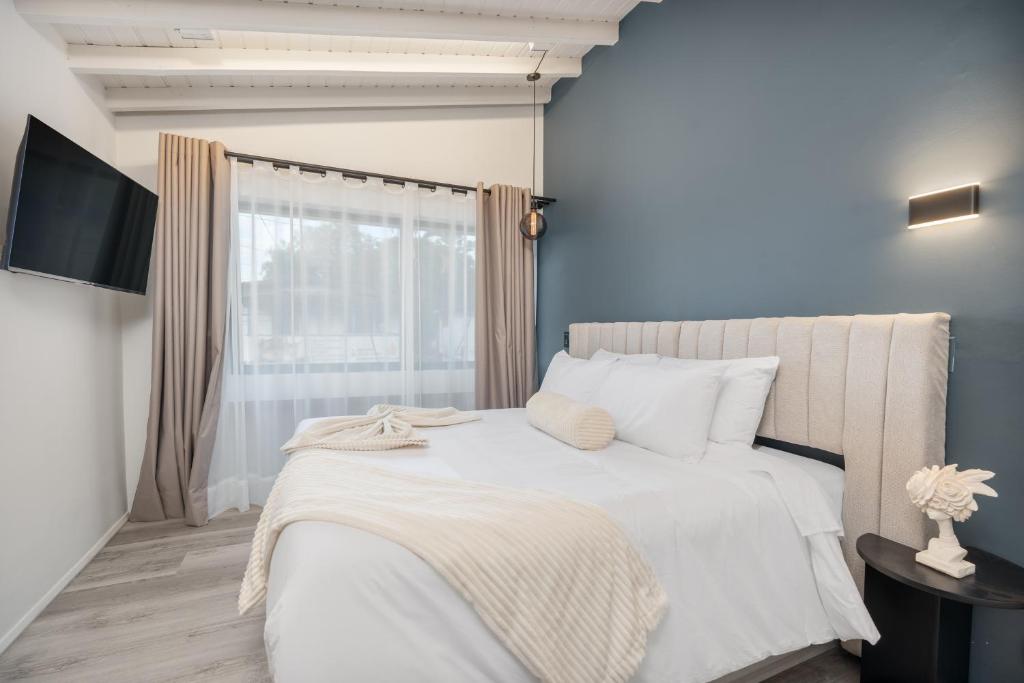 Postel nebo postele na pokoji v ubytování Nago Hometel Boutique
