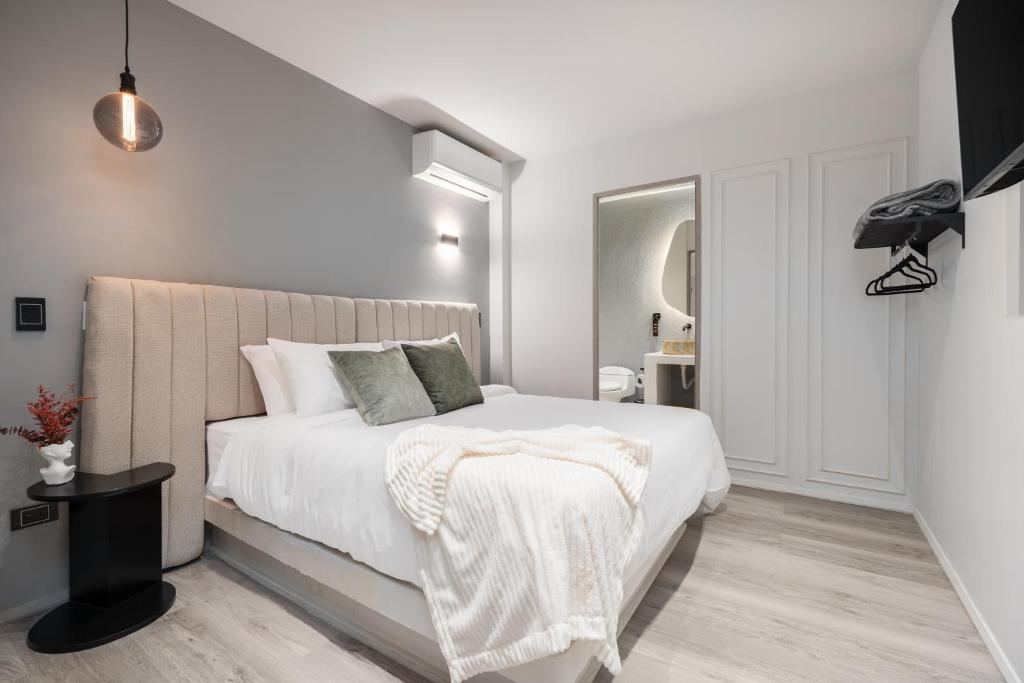 Postel nebo postele na pokoji v ubytování Nago Hometel Boutique