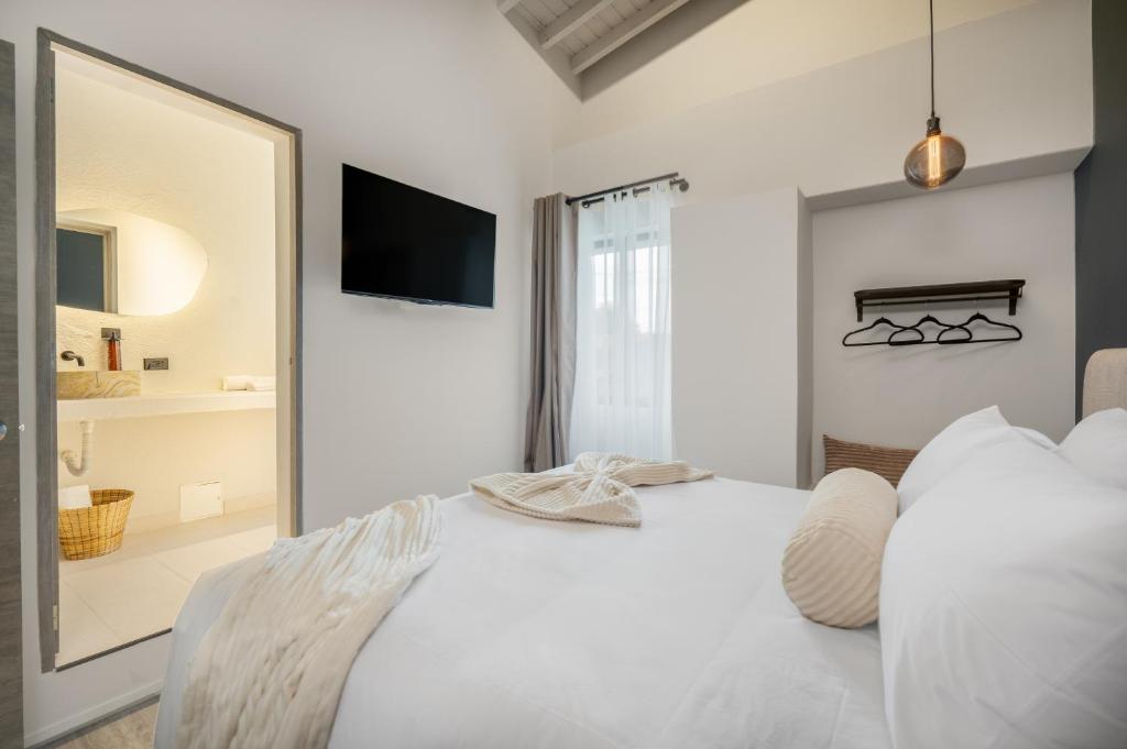 Postel nebo postele na pokoji v ubytování Nago Hometel Boutique