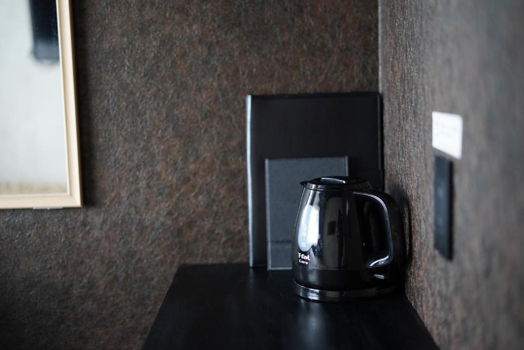 Příslušenství pro přípravu čaje a kávy v ubytování Hotel Chino