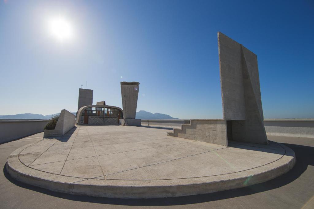 a monument with a view of the ocean at Hotel le Corbusier in Marseille