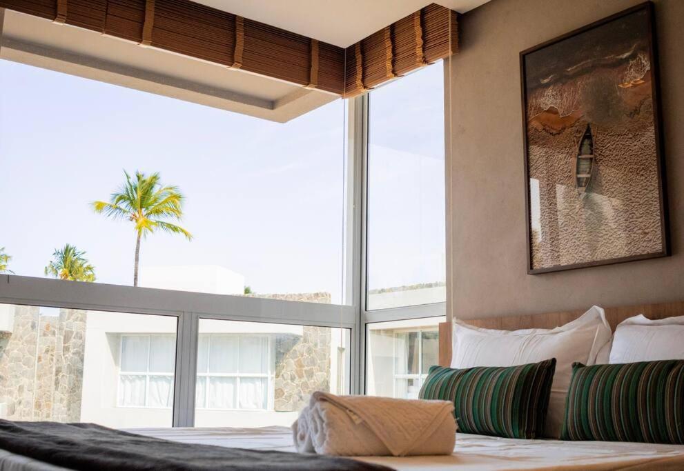 Postel nebo postele na pokoji v ubytování Casa Corais Milagres