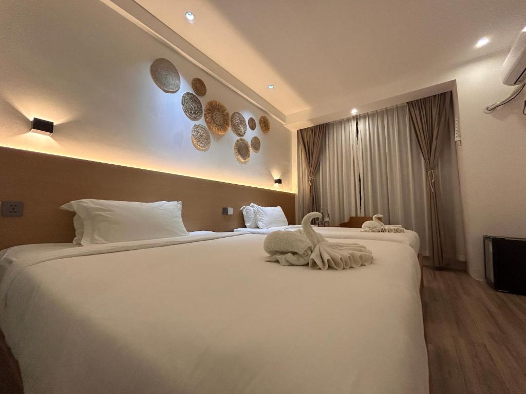 Postel nebo postele na pokoji v ubytování Fun Hotel
