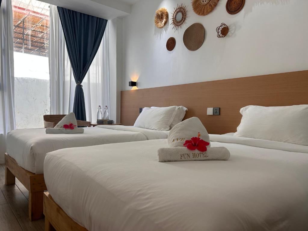 Postel nebo postele na pokoji v ubytování Fun Hotel