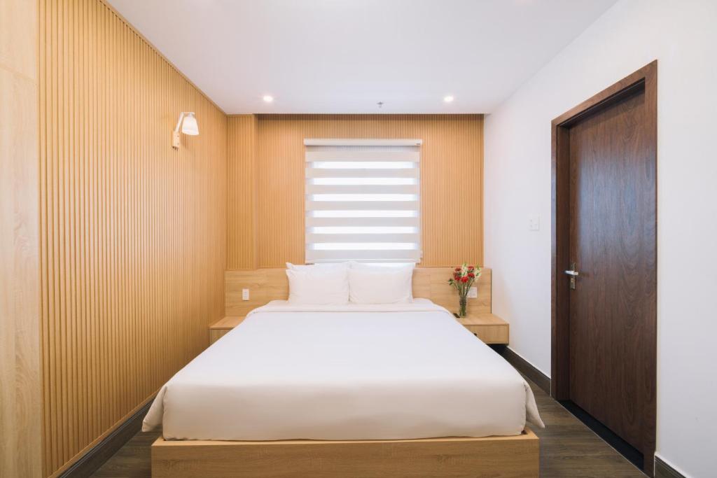 Postel nebo postele na pokoji v ubytování HOANG LINH PHAT HOTEL