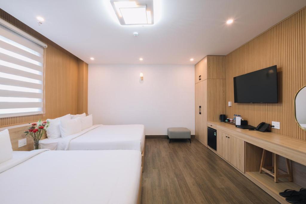 Postel nebo postele na pokoji v ubytování HOANG LINH PHAT HOTEL