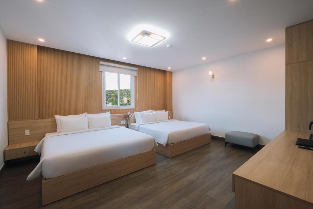 Postel nebo postele na pokoji v ubytování HOANG LINH PHAT HOTEL
