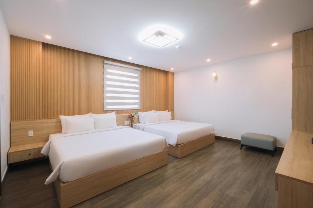 Postel nebo postele na pokoji v ubytování HOANG LINH PHAT HOTEL