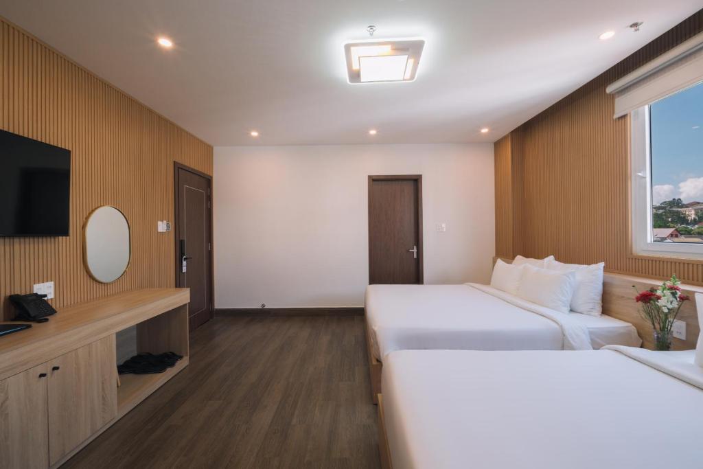 Postel nebo postele na pokoji v ubytování HOANG LINH PHAT HOTEL
