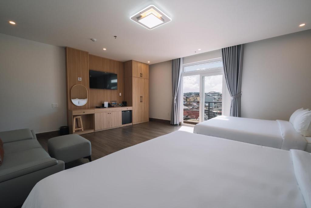 Postel nebo postele na pokoji v ubytování HOANG LINH PHAT HOTEL