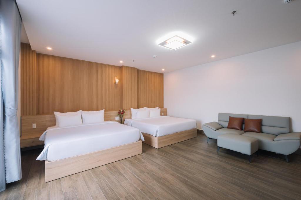 Postel nebo postele na pokoji v ubytování HOANG LINH PHAT HOTEL
