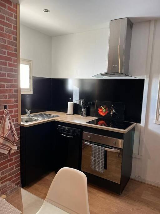 Kuchyň nebo kuchyňský kout v ubytování Appartement avec vue imprenable et tout le confort