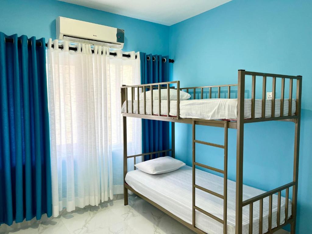 Postel nebo postele na pokoji v ubytování Havelock City Hostel, Colombo