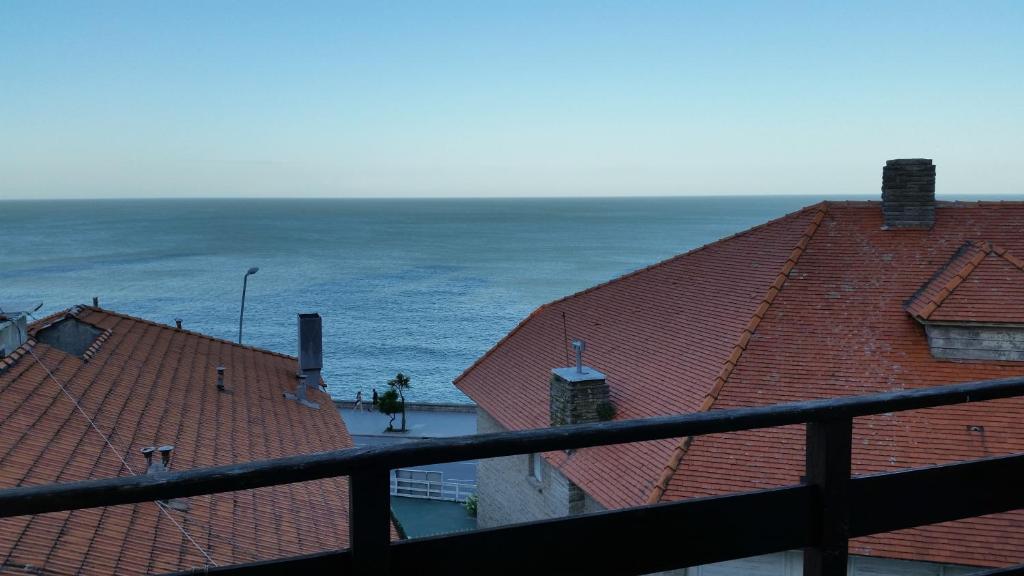 a view of the ocean from the roofs of buildings at Studio Playa Varesse in Mar del Plata