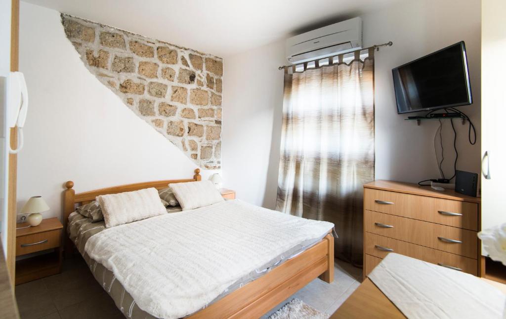 Postel nebo postele na pokoji v ubytování La Perla Luxury Apartments