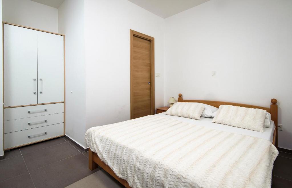 Postel nebo postele na pokoji v ubytování La Perla Luxury Apartments