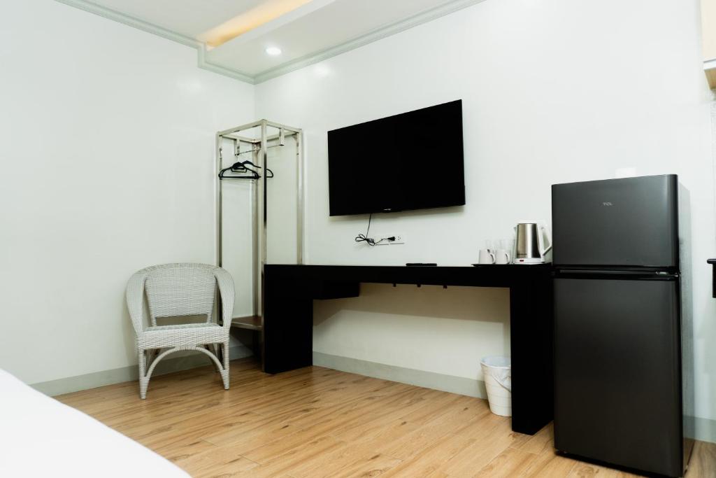 Kuchyň nebo kuchyňský kout v ubytování Madison Suites