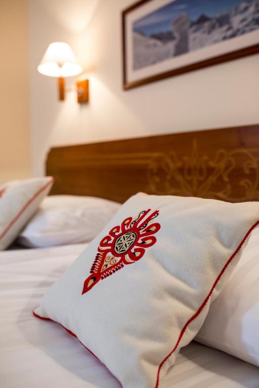 Postel nebo postele na pokoji v ubytování Hotel Logos