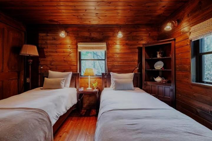 Postel nebo postele na pokoji v ubytování Nasu Country Cottage