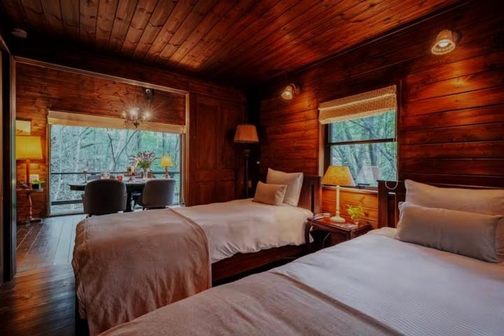 Postel nebo postele na pokoji v ubytování Nasu Country Cottage