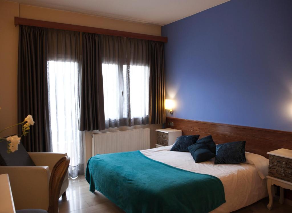 Postel nebo postele na pokoji v ubytování Hotel & Spa Can Josep
