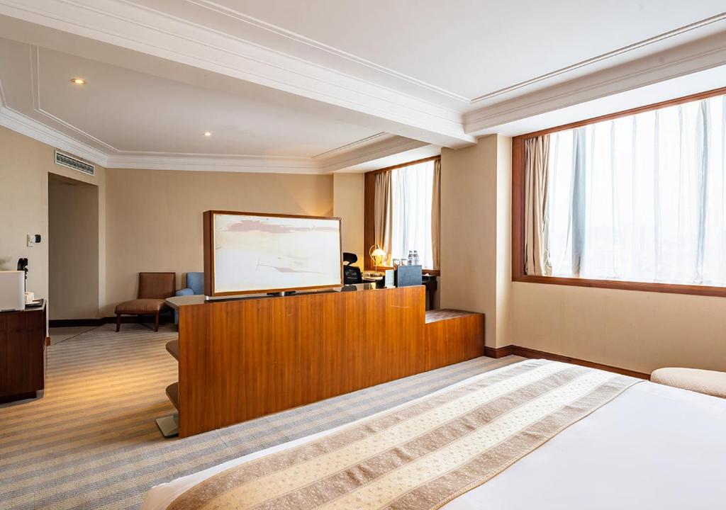 Postel nebo postele na pokoji v ubytování San Want Hotel Shanghai