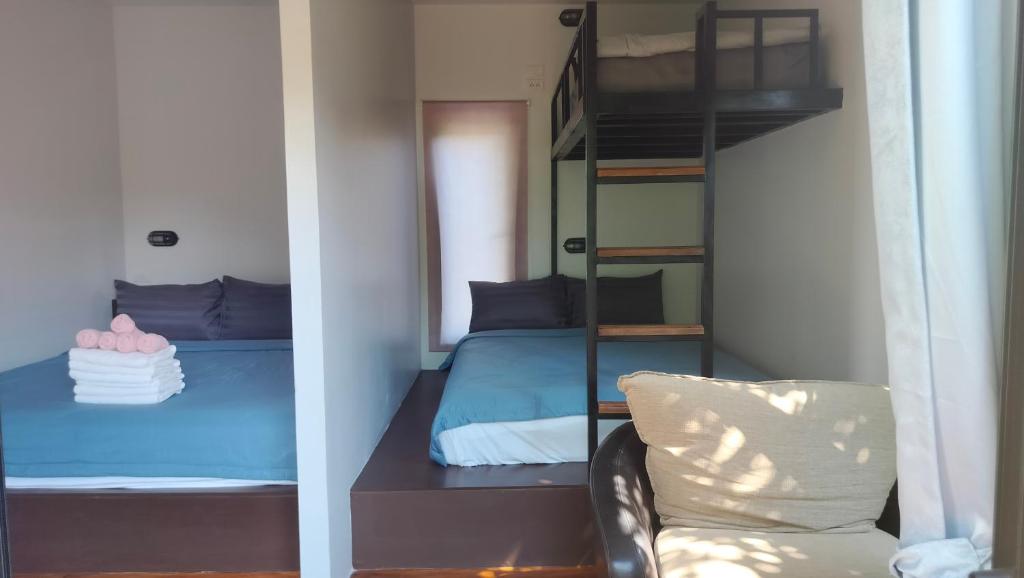 Postel nebo postele na pokoji v ubytování Na Na Doo Homestay