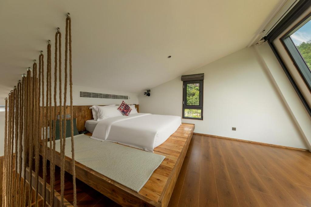Postel nebo postele na pokoji v ubytování Wonderland Resort