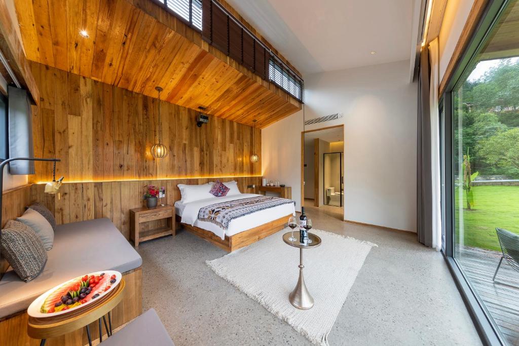 Postel nebo postele na pokoji v ubytování Wonderland Resort