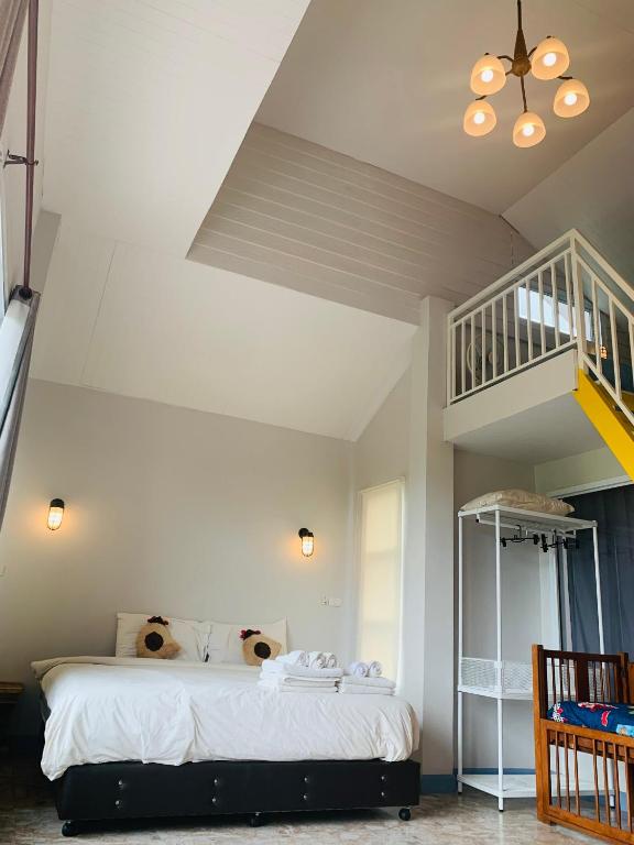 Postel nebo postele na pokoji v ubytování Na Na Doo Homestay