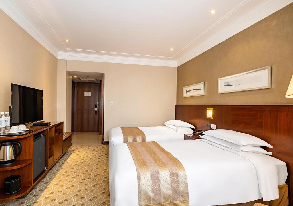 TV a/nebo společenská místnost v ubytování San Want Hotel Shanghai