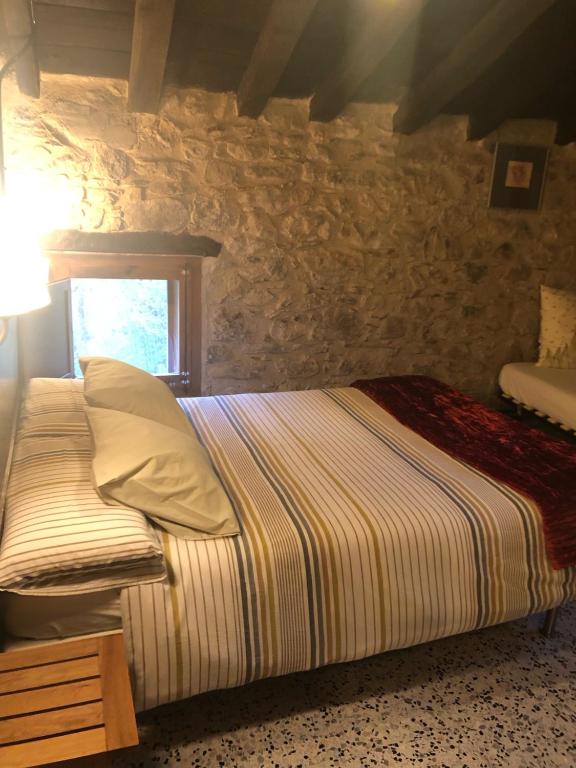 A bed or beds in a room at Mas Molladar solo adultos