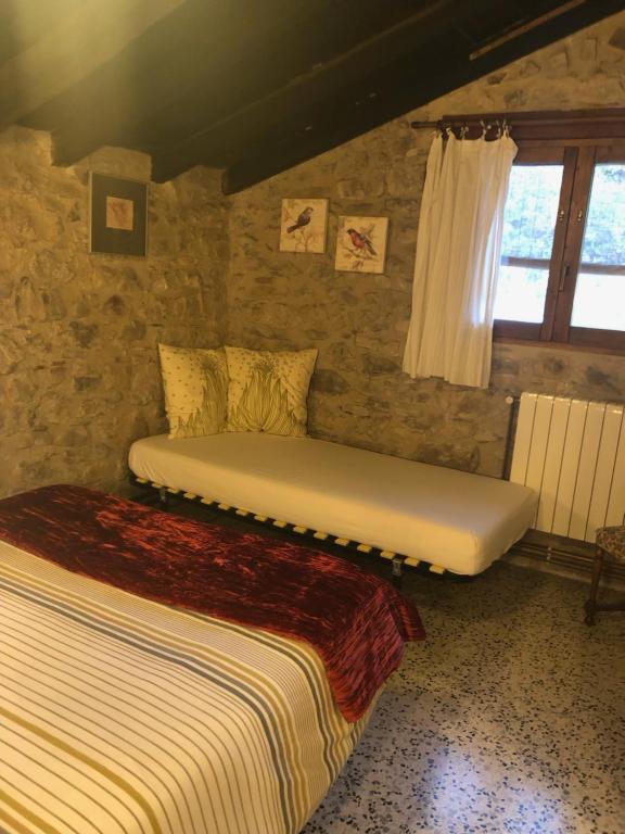 A bed or beds in a room at Mas Molladar solo adultos