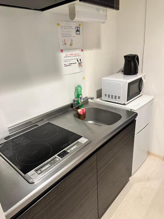 Kuchyň nebo kuchyňský kout v ubytování Residence天王寺東