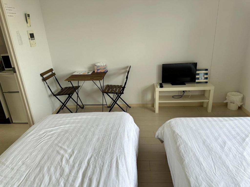 TV a/nebo společenská místnost v ubytování Residence天王寺東