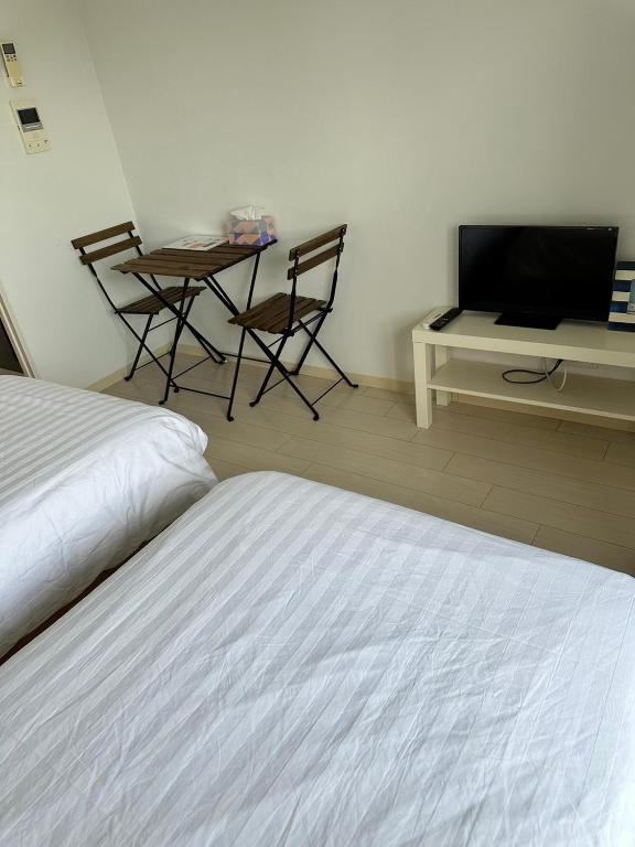 TV a/nebo společenská místnost v ubytování Residence天王寺東