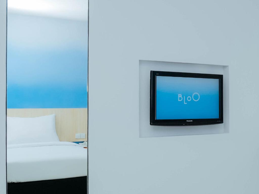 Postel nebo postele na pokoji v ubytování Bloo Bali Hotel