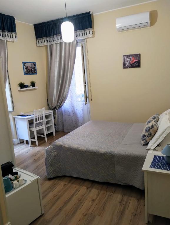 Łóżko lub łóżka w pokoju w obiekcie Al Quadrato D'Oro rooms