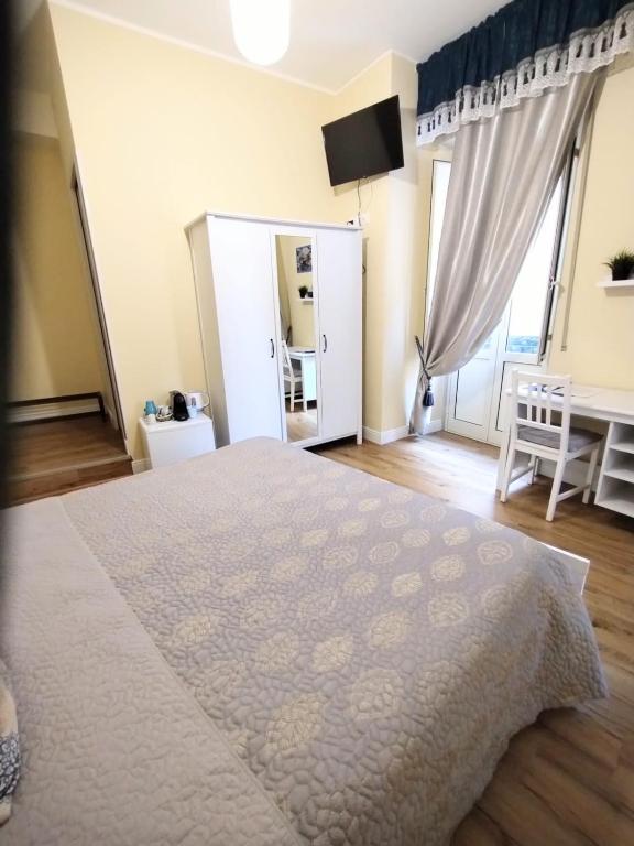 Łóżko lub łóżka w pokoju w obiekcie Al Quadrato D'Oro rooms