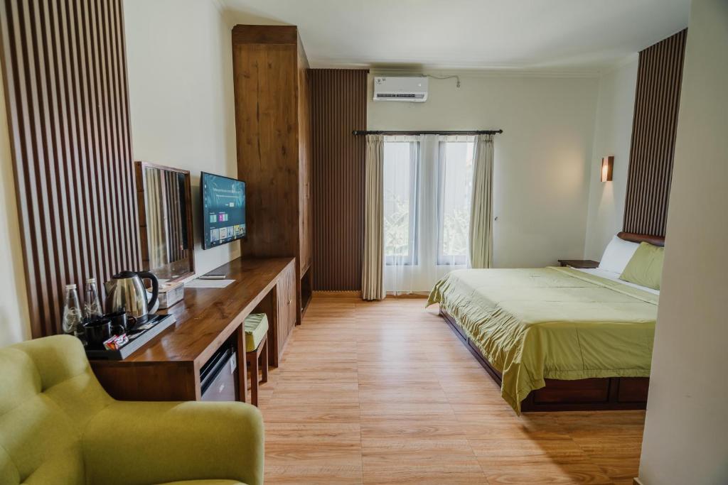 Postel nebo postele na pokoji v ubytování You Suite Seminyak