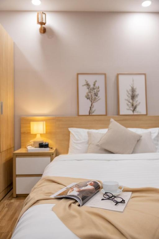 Postel nebo postele na pokoji v ubytování Phương Trinh Hotel