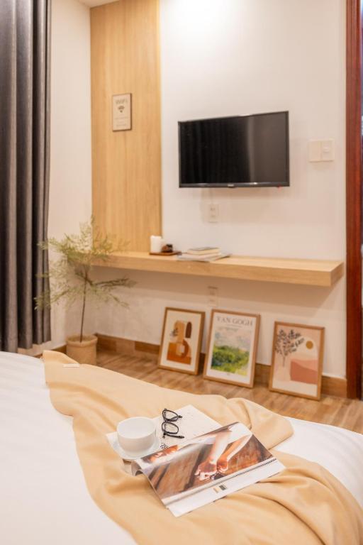 Postel nebo postele na pokoji v ubytování Phương Trinh Hotel