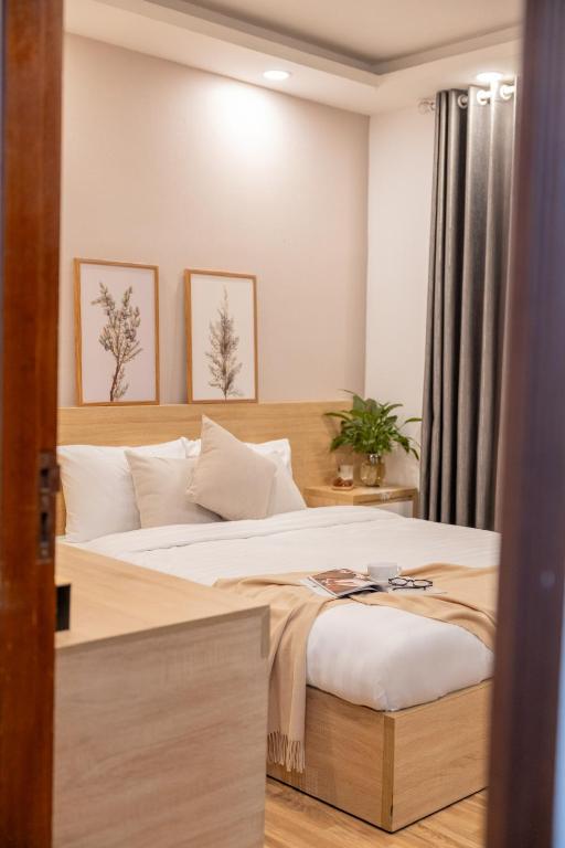 Postel nebo postele na pokoji v ubytování Phương Trinh Hotel